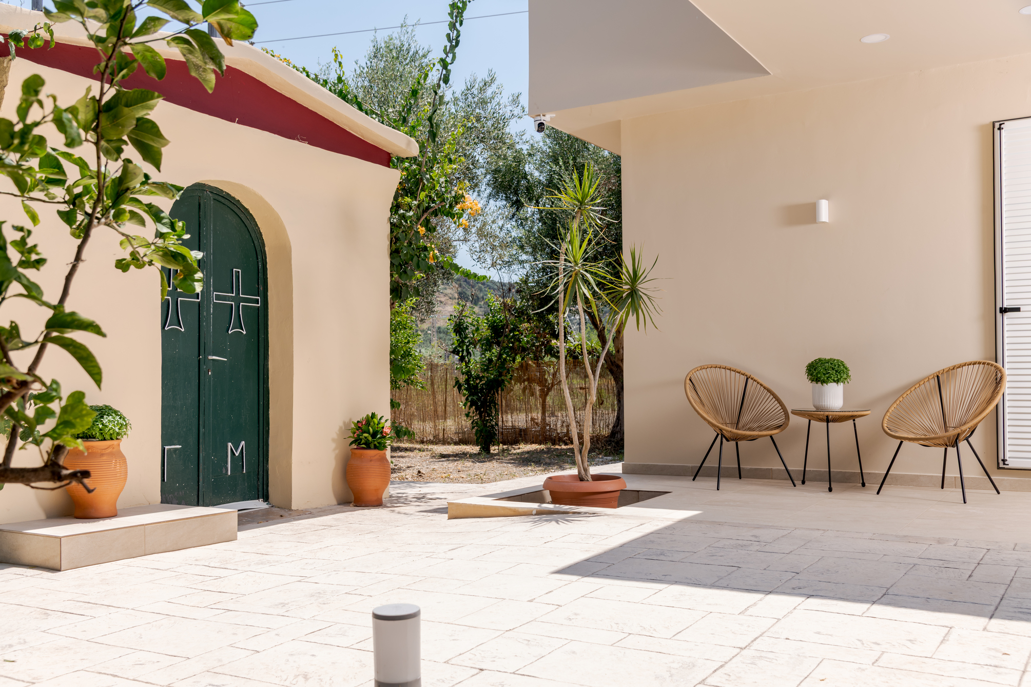 Traditional private family chapel among olive and orange trees
